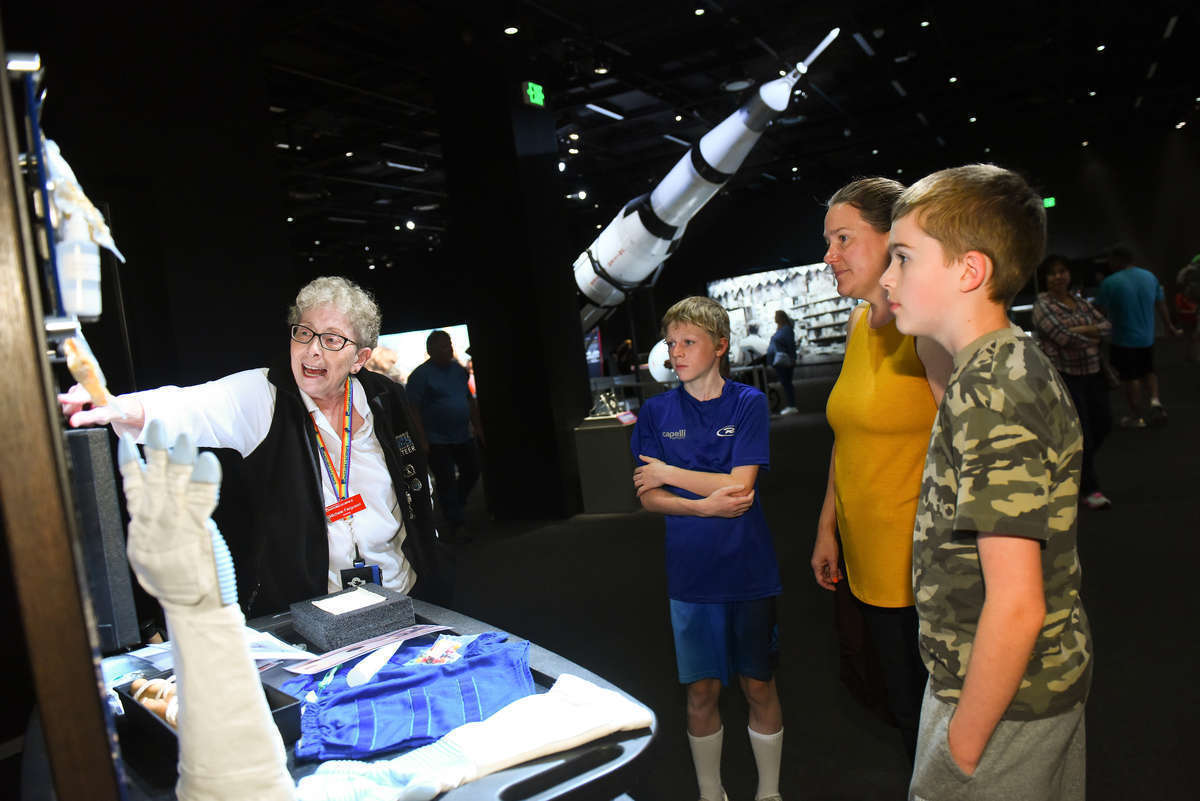 A volunteer points to a specimen