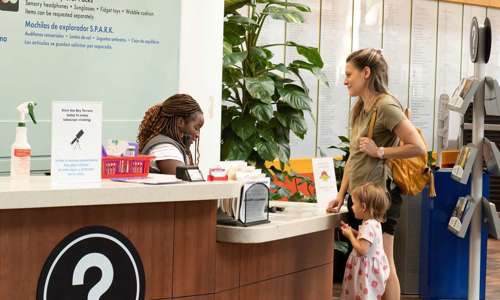 A mom and a daughter at the information desk