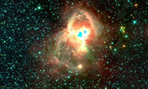 Image from space of the aquila rift, showing a bright cloud in a black abyss with bright dots all around