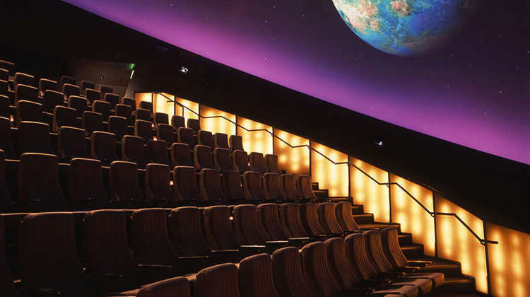 Planetarium seating with image of Earth projected