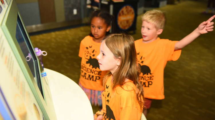 three children look at a video display in Expedition health