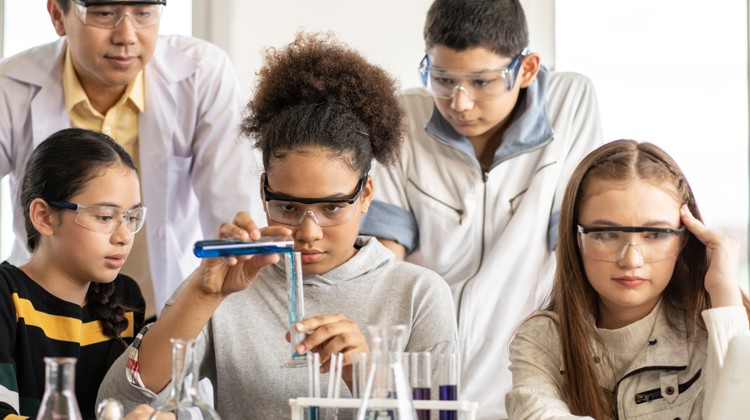 Teacher and students doing a chemistry project