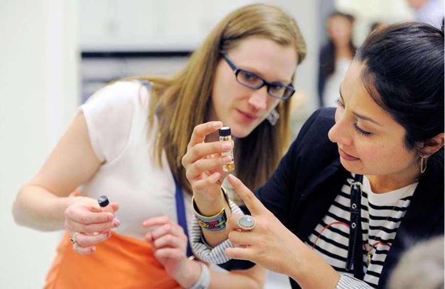Two people look at a specimen