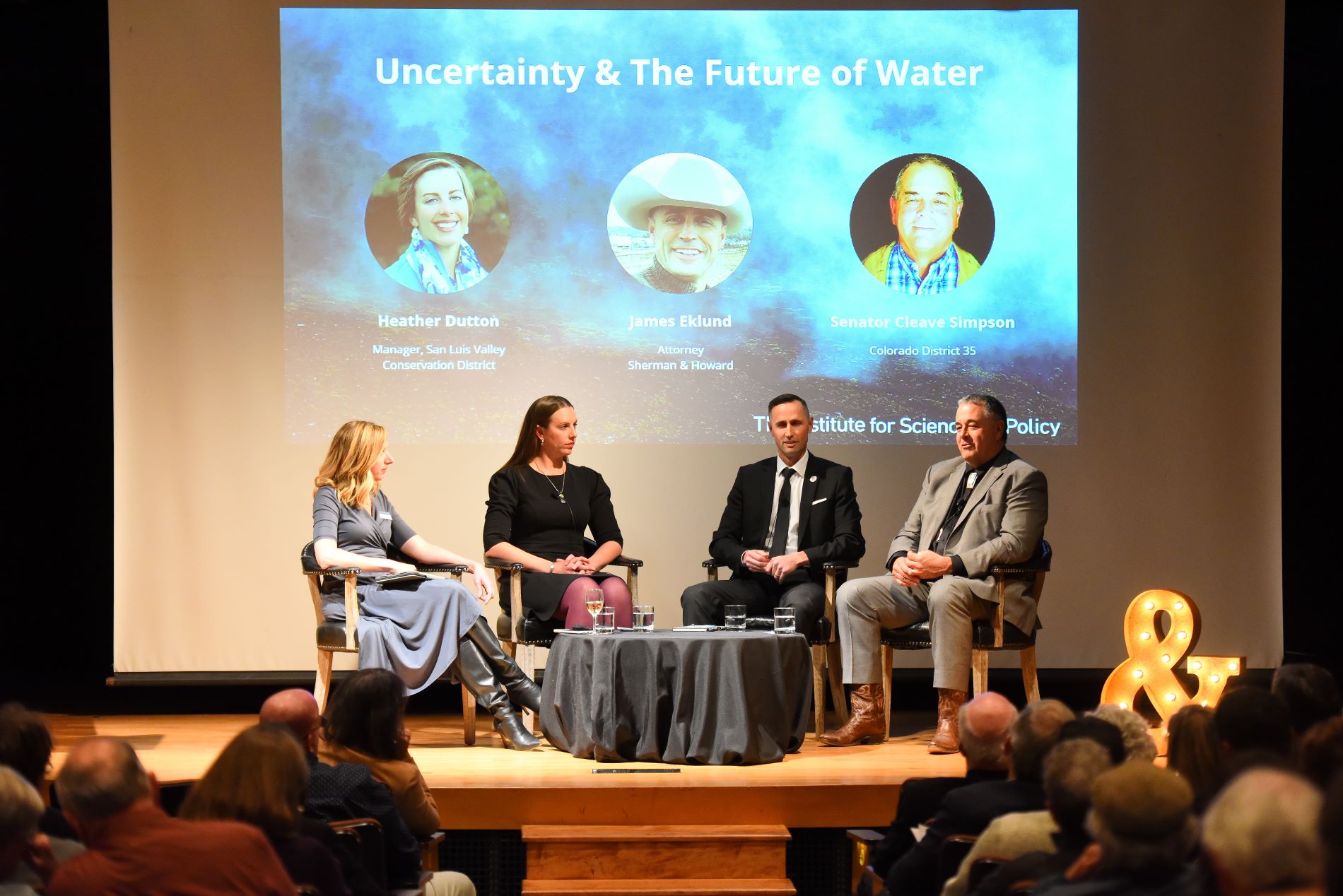  Kristan Uhlenbrock, far left, executive director of the Institute for Science and Policy, moderates a panel on the future of water in Colorado featuring Heather Dutton, Manager San Luis Valley Conservation District, James Eklund, water and natural resources attorney with Sherman and Howard, and Colorado Sen. Cleve Simpson. (Photo/ Chris Schneider)