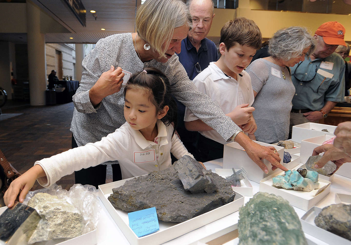 A girl and her family learn more about the Museum's gems collections