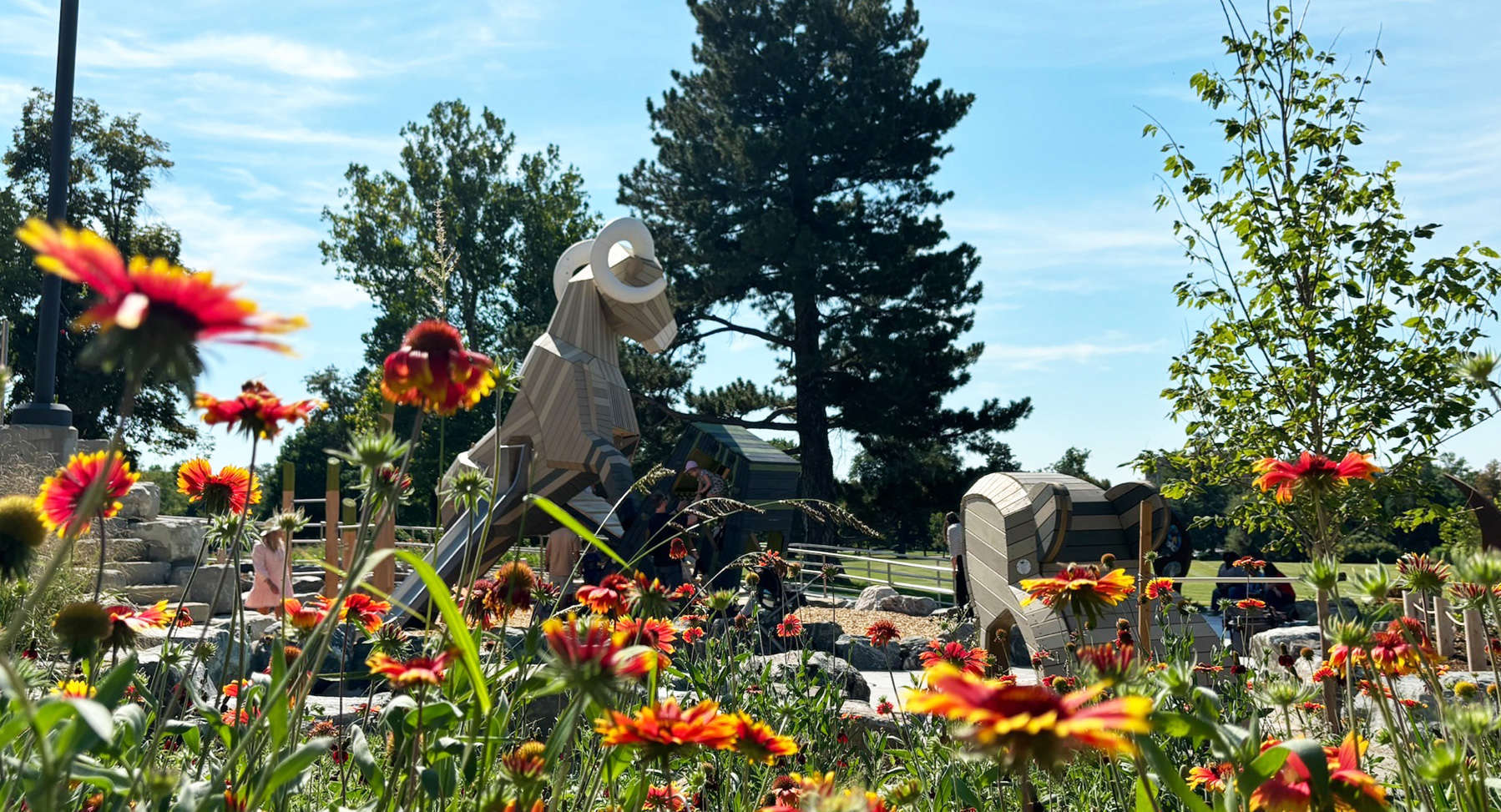 Flowers blooming in foreground; Ram structure in background