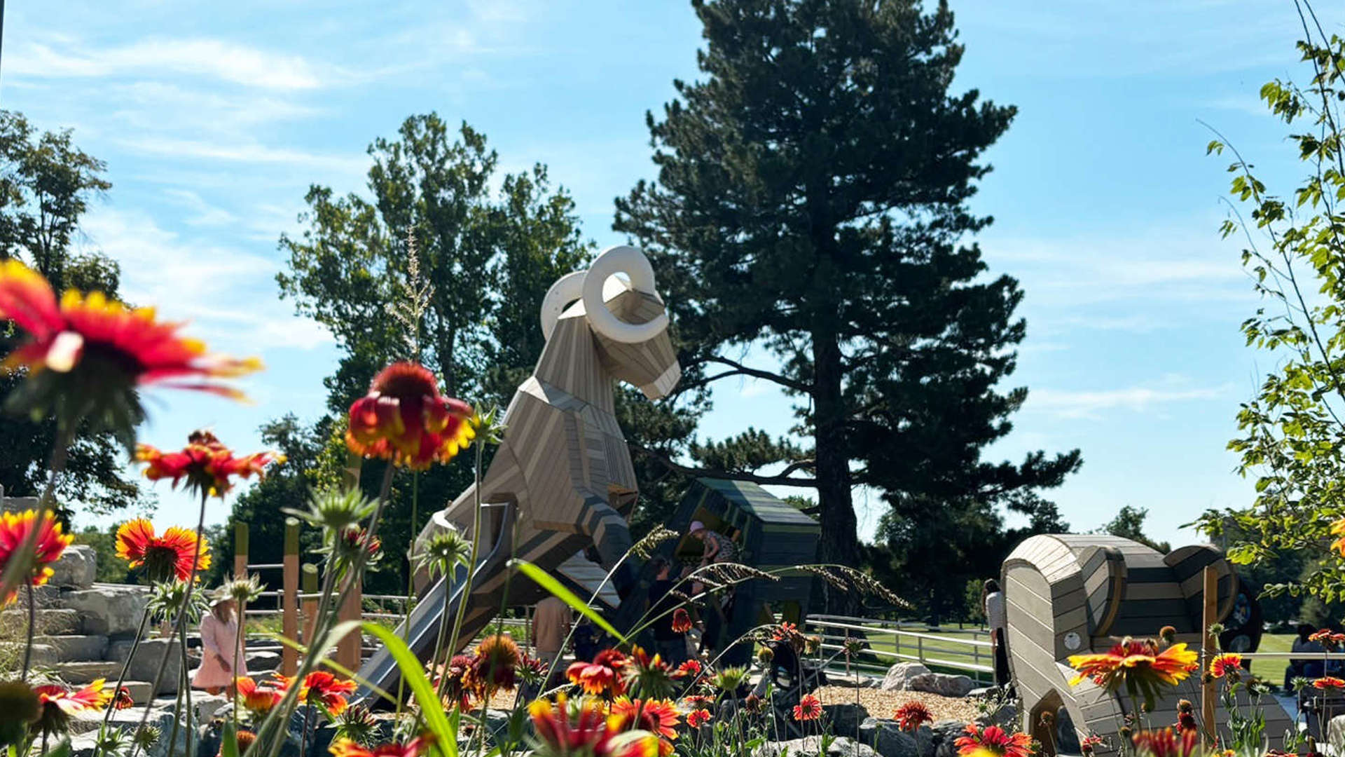 Flowers blooming in foreground; Ram structure in background
