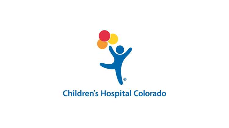 Dancing person icon holding red, yellow, and orange balloons, over text reading Children's Hospital Colorado