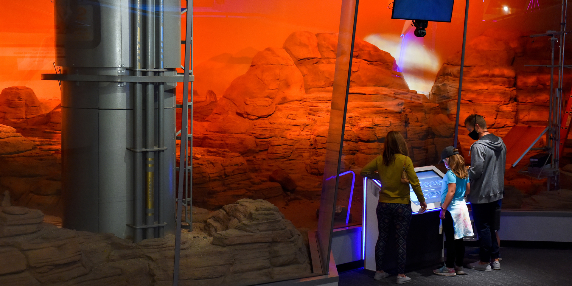 Guests Standing In Front Of The Mars Diorama